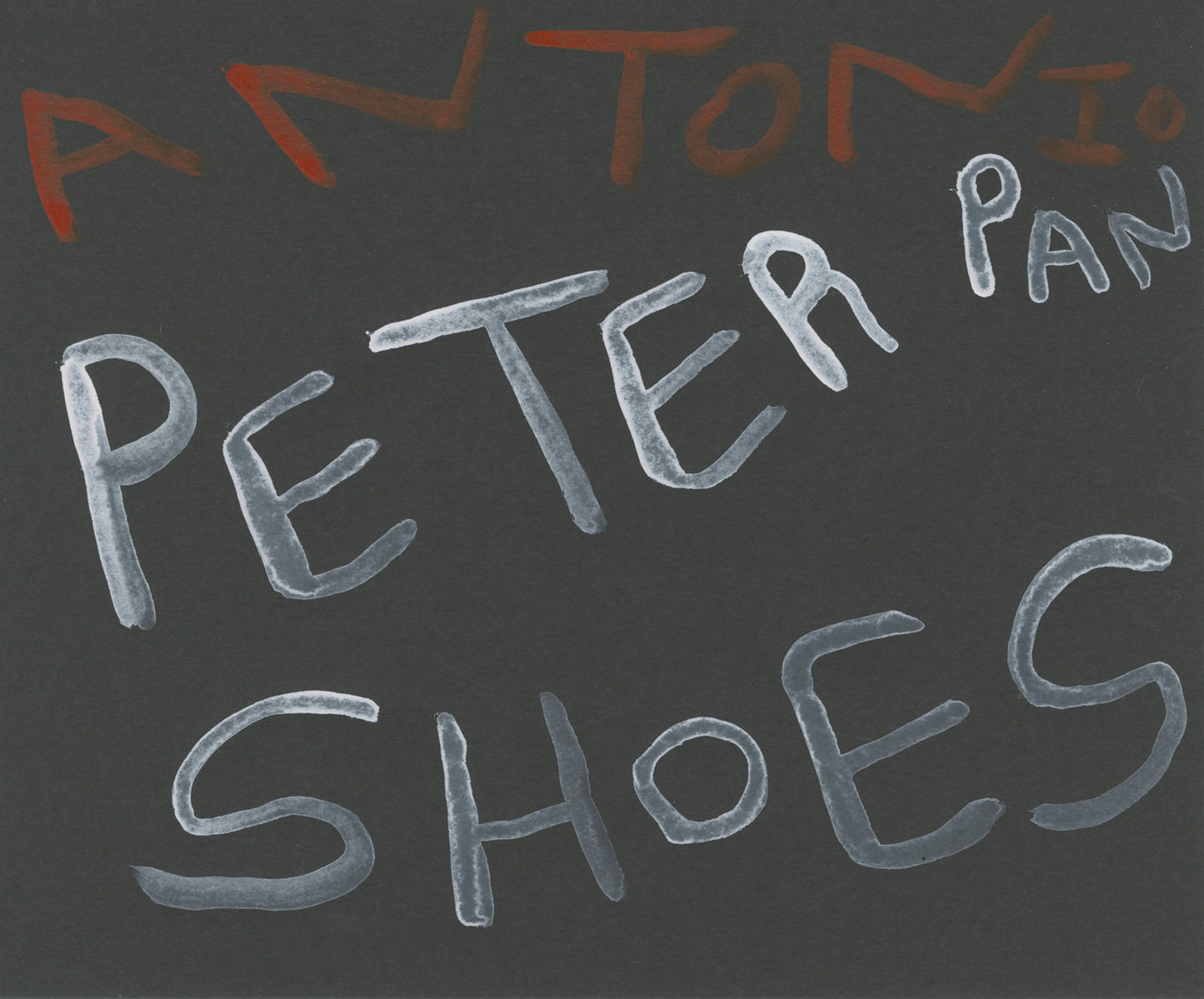 Text 'ANTONIO PETER PAN SHOES' written with acrylic marker on black paper.