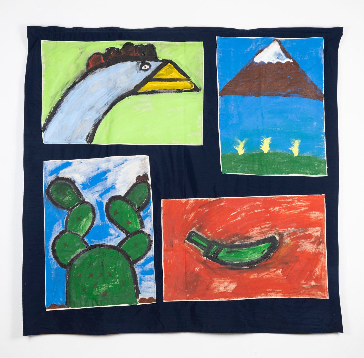 A dark navy quilt with four painted appliqué squares, each illustrating a different scene or symbol. Clockwise from the top left, the painted scenes depict a white chicken's head, shown in profile, with a pale green background; a brown snow-capped mountain floating on a blue field, over a thin strip of green ground and yellow plants sprouting; a green chili pepper floating on a red backdrop; and finally a green cactus sprouting under a cloudy blue sky.