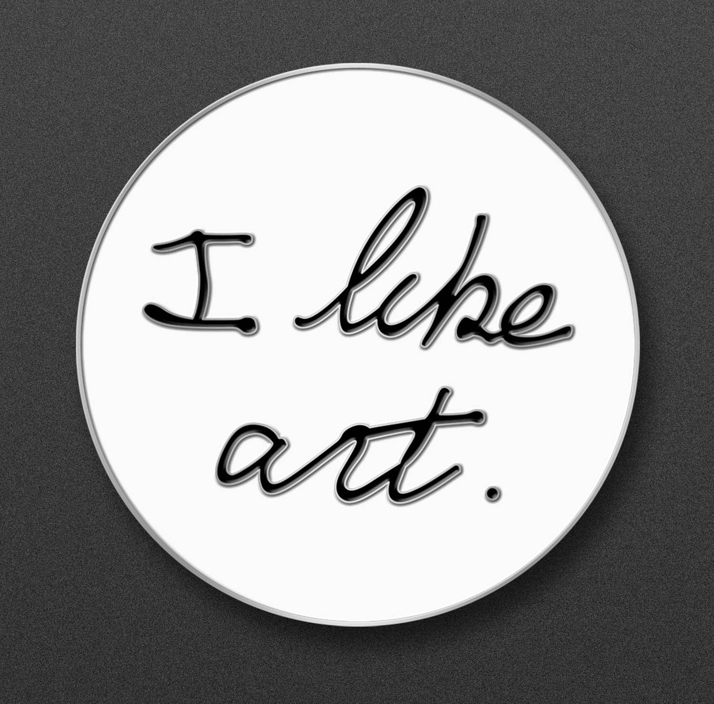 Circular enamel pin with 'I like art.' text on a white background.