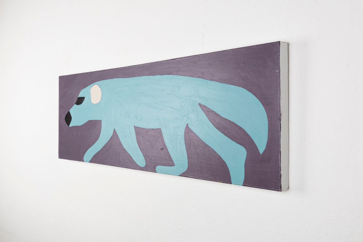 This is a stylized painting of a wolverine, the body of the wolverine is a light blue, with white ears and black eyes and nose, against a purple background.