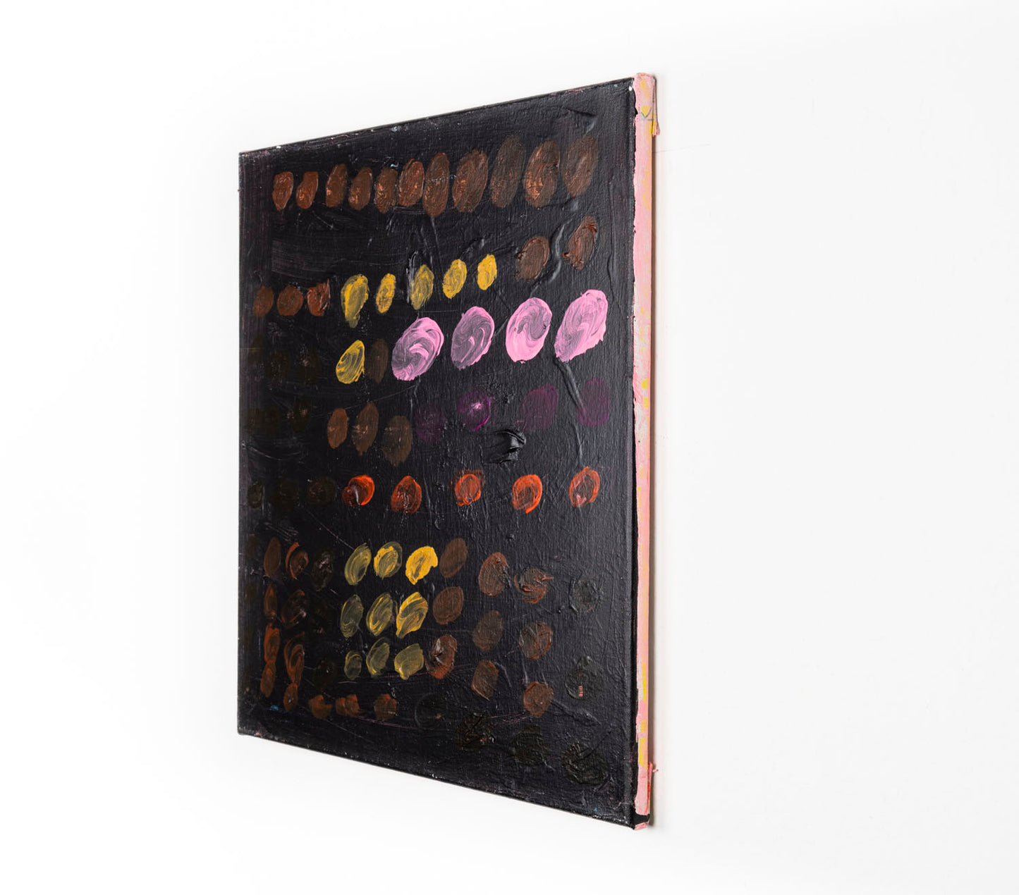 Rows and rows of multi-colored dots fill the canvas. The dots are shades of brown, orange, pink, purple and yellow; varying in size and opacity against a black background.