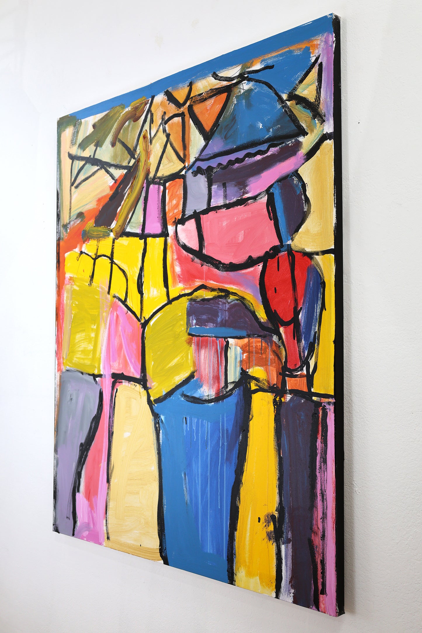 The same painting photographed from an angle to show the thin dimensions. The side of the canvas has been painted black.