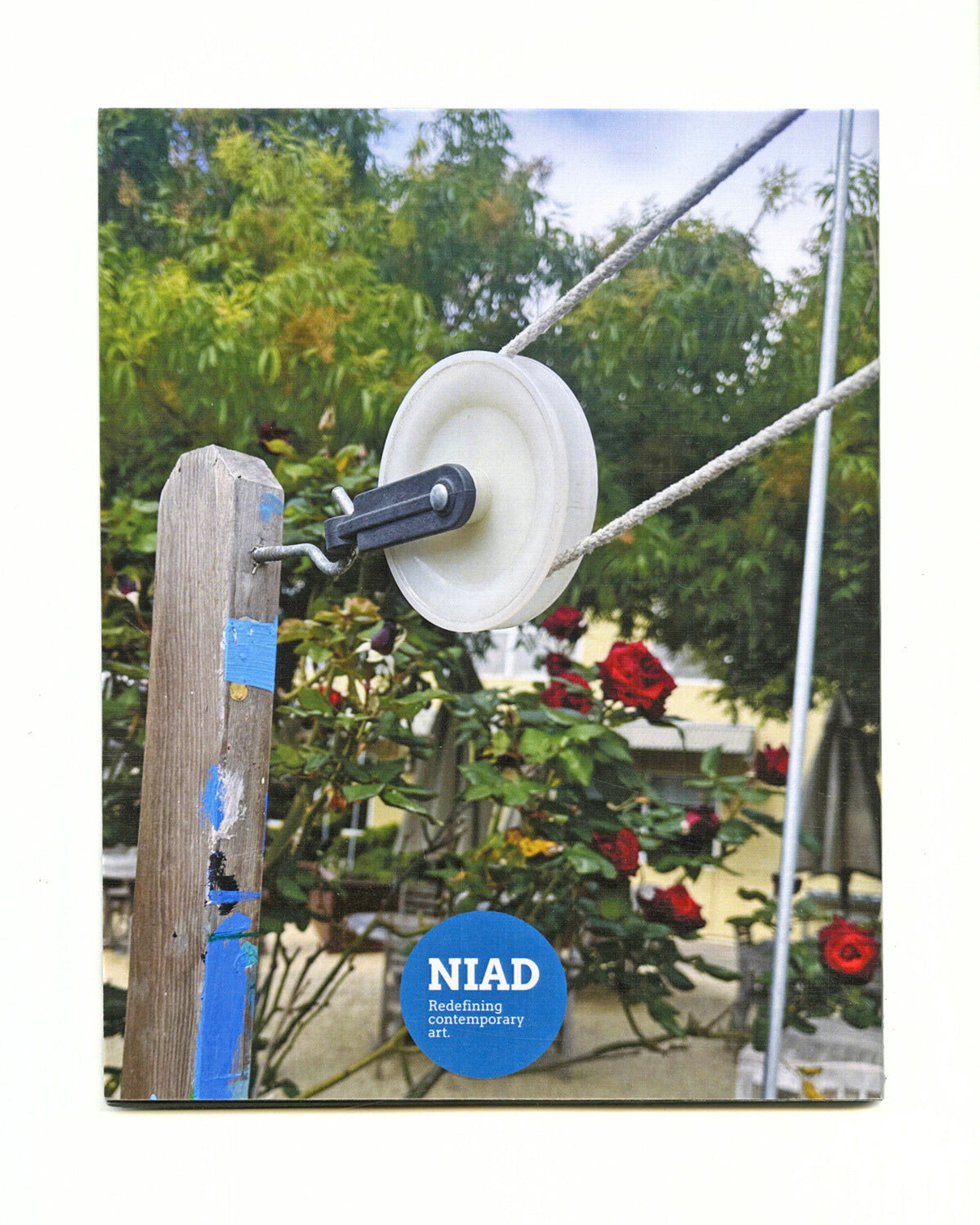 Back cover of Pulley exhibition catalog with a close-up of a pulley, and the NIAD logo.