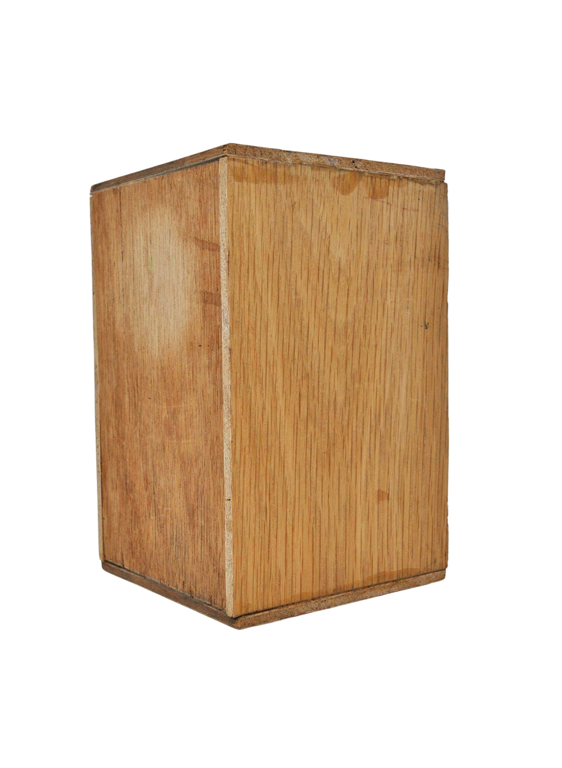 The frontside of a wooden cajon, a Peruvian hand drum, with a natural brown finish, photographed against a white background.
