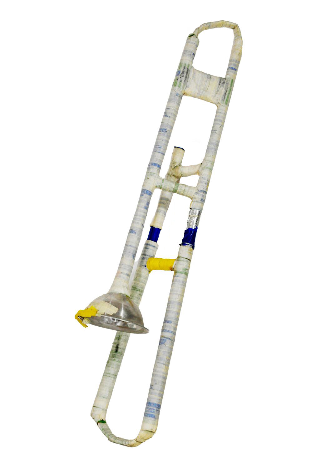 A trombone complete with a bell, slide, and tuning braces. The majority of the sculpture is wrapped in white tape with sections of blue and yellow peeking out. The bell of the trombone is silver with some remnants of yellow and white affixed to part of it.