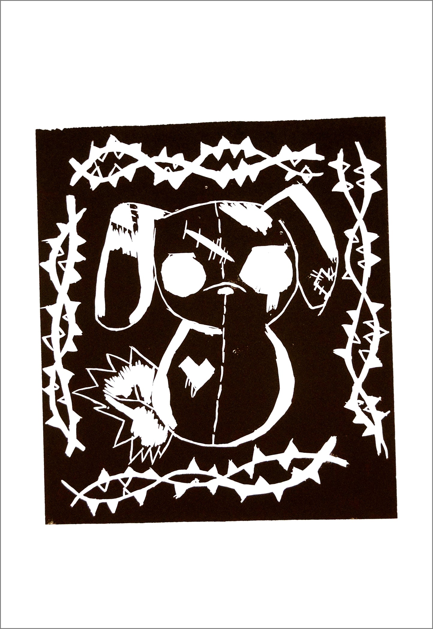 a print on white paper. There is a black square in the center of the paper, and the carved white outlines of a stuffed dog-shaped toy surrounded by double helix twists of thorny vines.