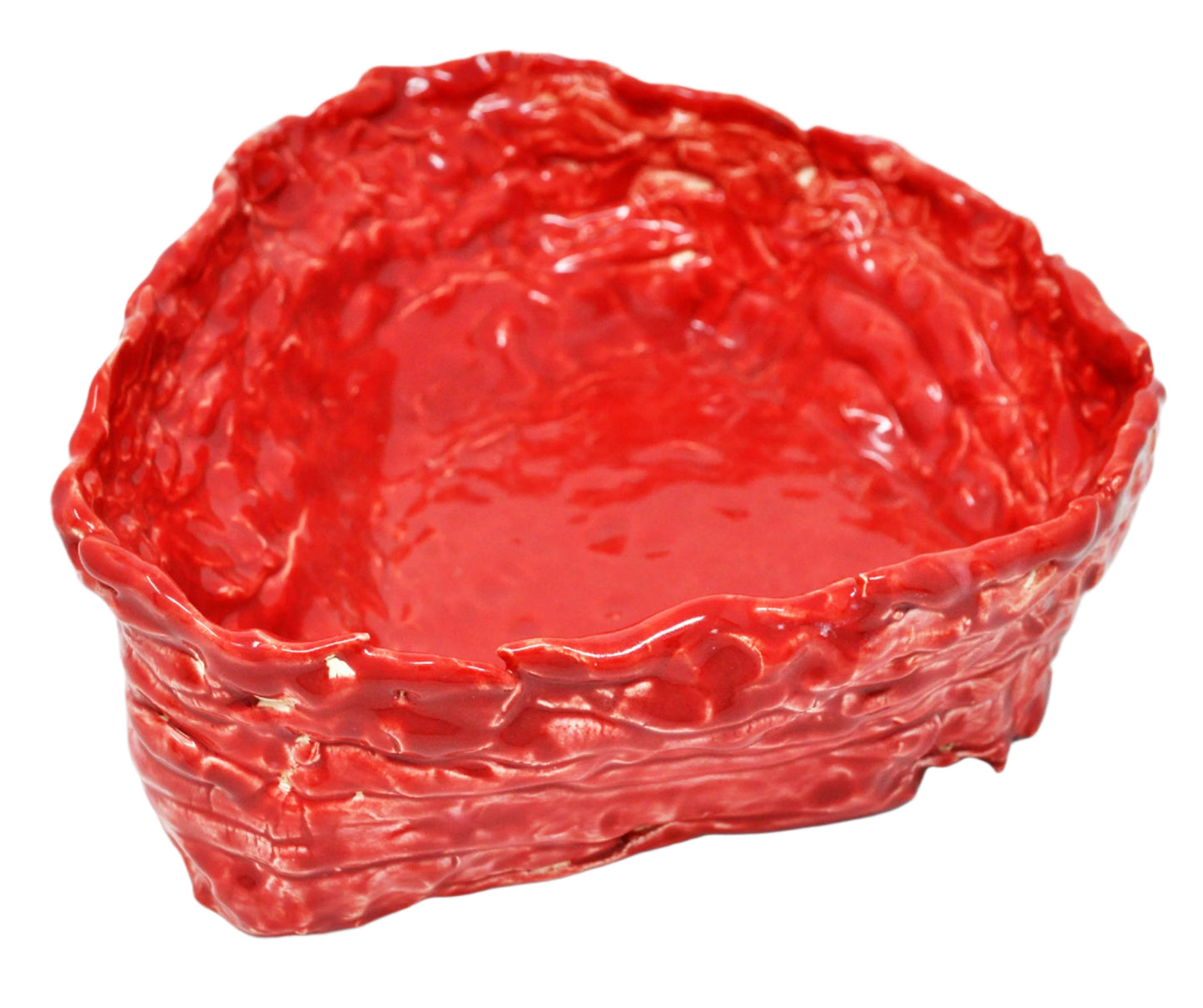 The same sculpture photographed from above. Here the interior of the vessel is in focus. The entire work is glazed in a shiny red color and each stacked coil that wraps around the perimeter of the piece is discernible.
