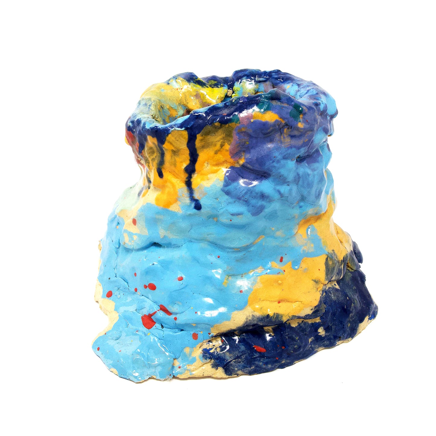 The same sculpture photographed from the back. From this angle, the opening of the vessel is not visible. The back exterior of the sculpture is shiny light blue, navy, and yellow.