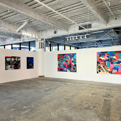 an installation shot of a large contemporary art gallery with slate floors, unfinished ceilings, and large abstract canvases