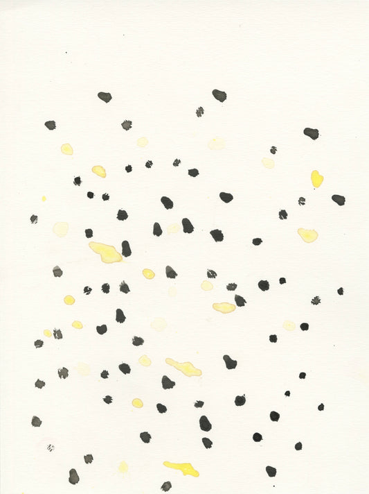 a pattern of dots painted on paper. the dots are black or yellow watercolor marks, and are arranged on the paper in a swirling pattern that radiates out toward the edges.