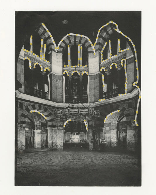 This mixed media piece incorporates gold and grey elements on a found magazine page. The magazine page contains a photograph of the Palatine Chapel. The arches of the chapel are outlined with grey marker and gold dots. 
