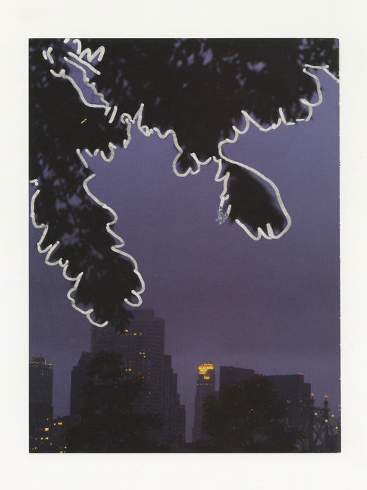 This mixed media piece contains an image of a cityscape. There are buildings in the background and leaves from a tree that occupy the top half of the image. The leaves on the tree are outlined in a bold silver.