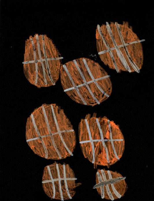 Seven basketballs against a black background.