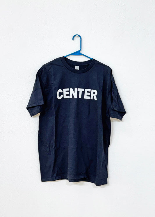 Black t-shirt with 'CENTER' printed on it, hanging on a white background, hanging from a blue hanger.