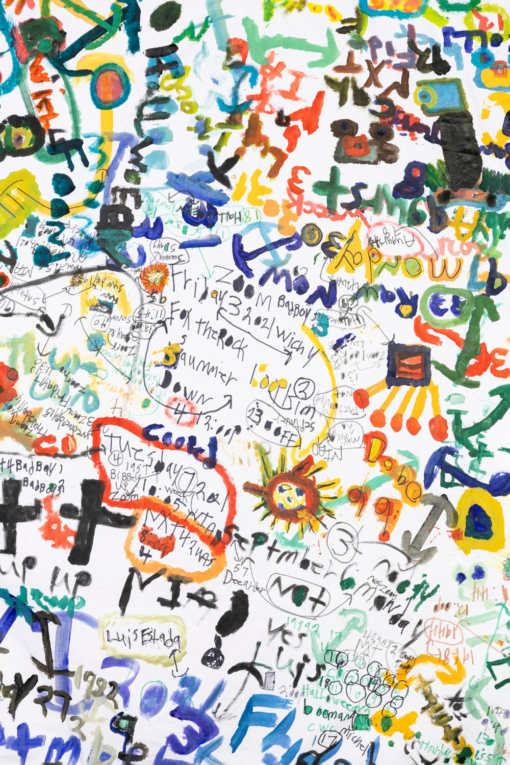 This fiber piece has a collage-like quality, with the combination of text and icons overlapping one another to form the composition of the piece. The text and icons are multi-colored; black, green, red, blue and yellow that contrast the white background. 