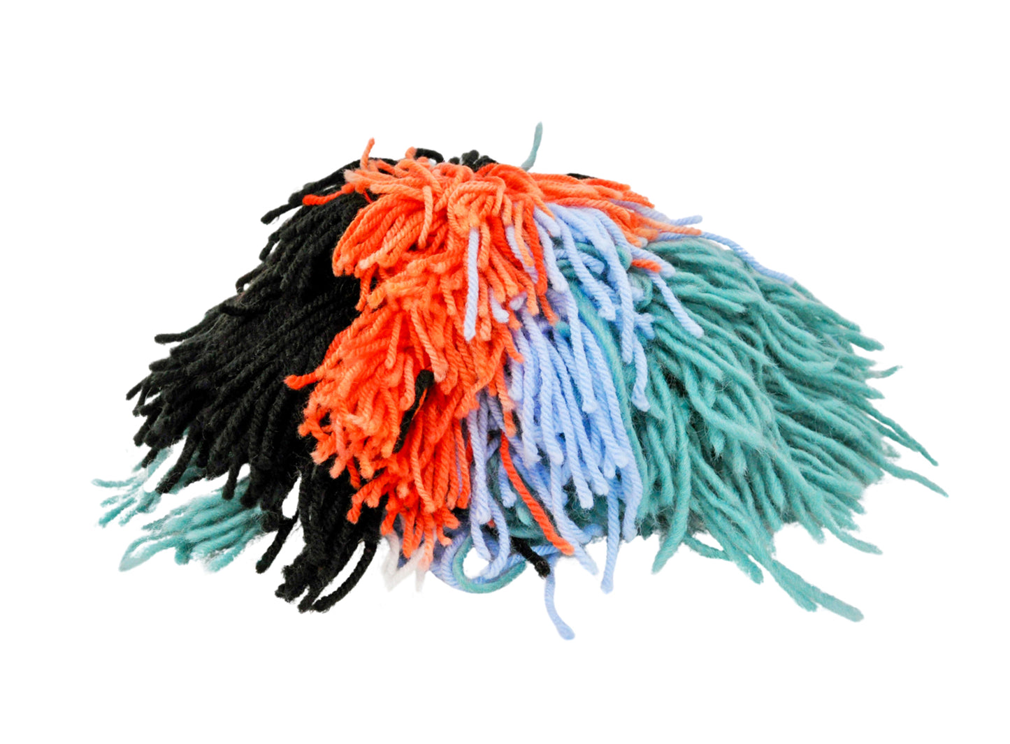 a photo of a colorful yarn pom pom ball: long shaggy bits of green, red, and black yarn are knotted together in a round clump.