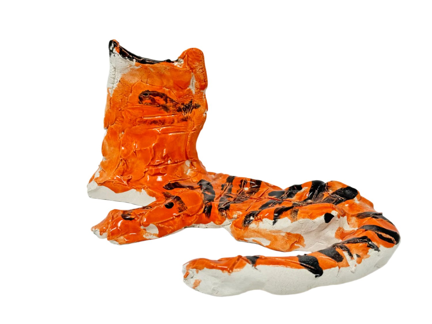 The same sculpture photographed from the back angle. Here, the long striped tail and the bright orange back of the head are in focus.