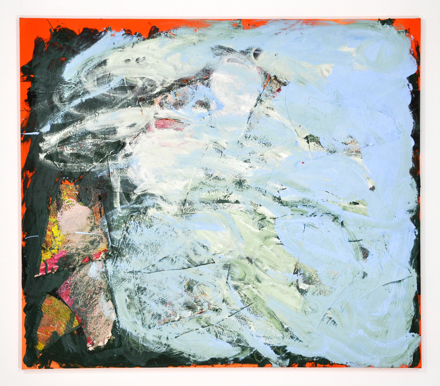 An abstract painting on a large square canvas. Around the edges, the bright orange ground peeks out behind layers of thick black and a huge cloud of mottled pale blue paint. 