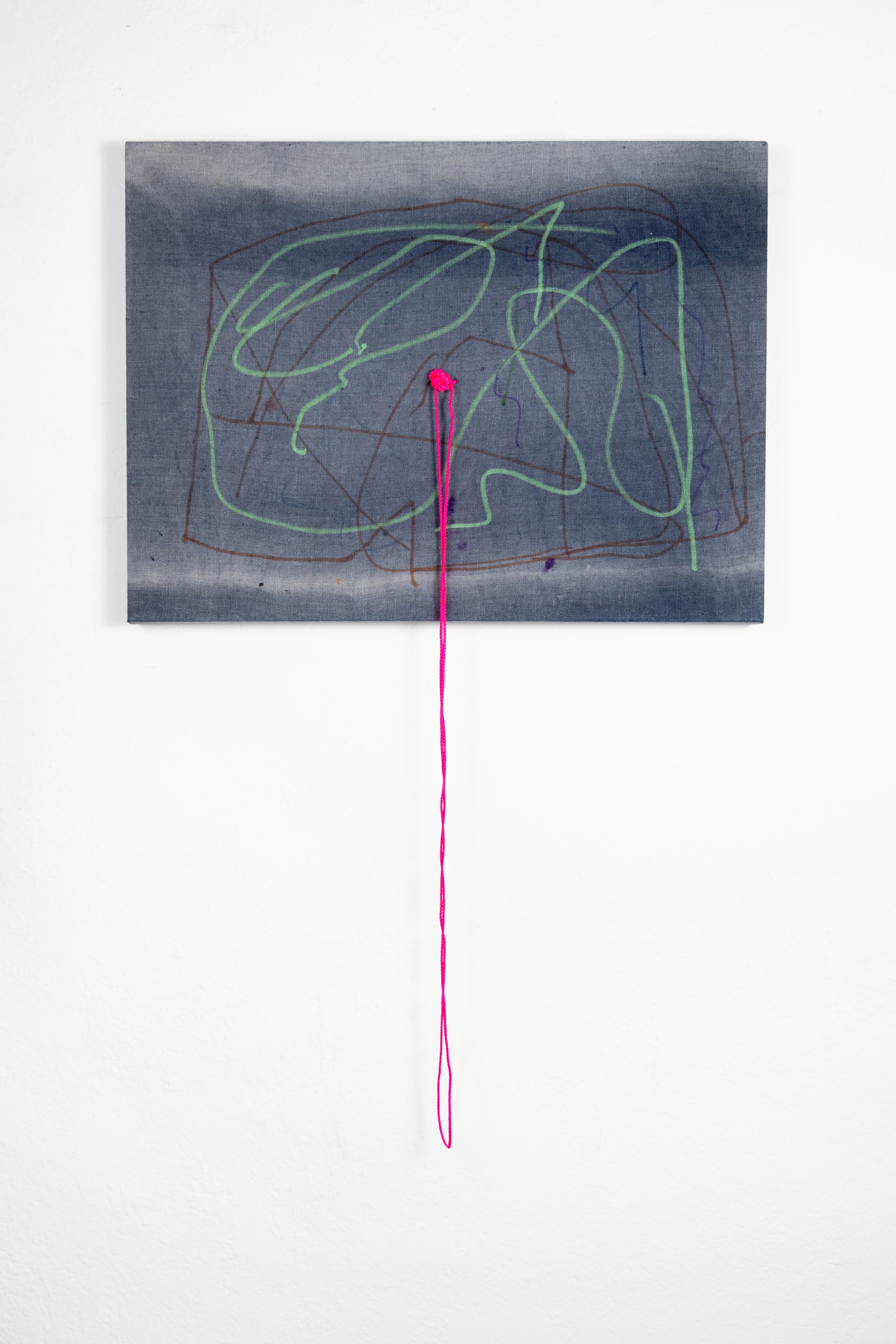  A rectangle artwork on stretched gray fabric that has been sun bleached. There are green and burgundy acrylic marker squiggle lines throughout. In the middle of the artwork, a neon pink string has been knotted and strung through, and hangs loose a few inches below the artwork.