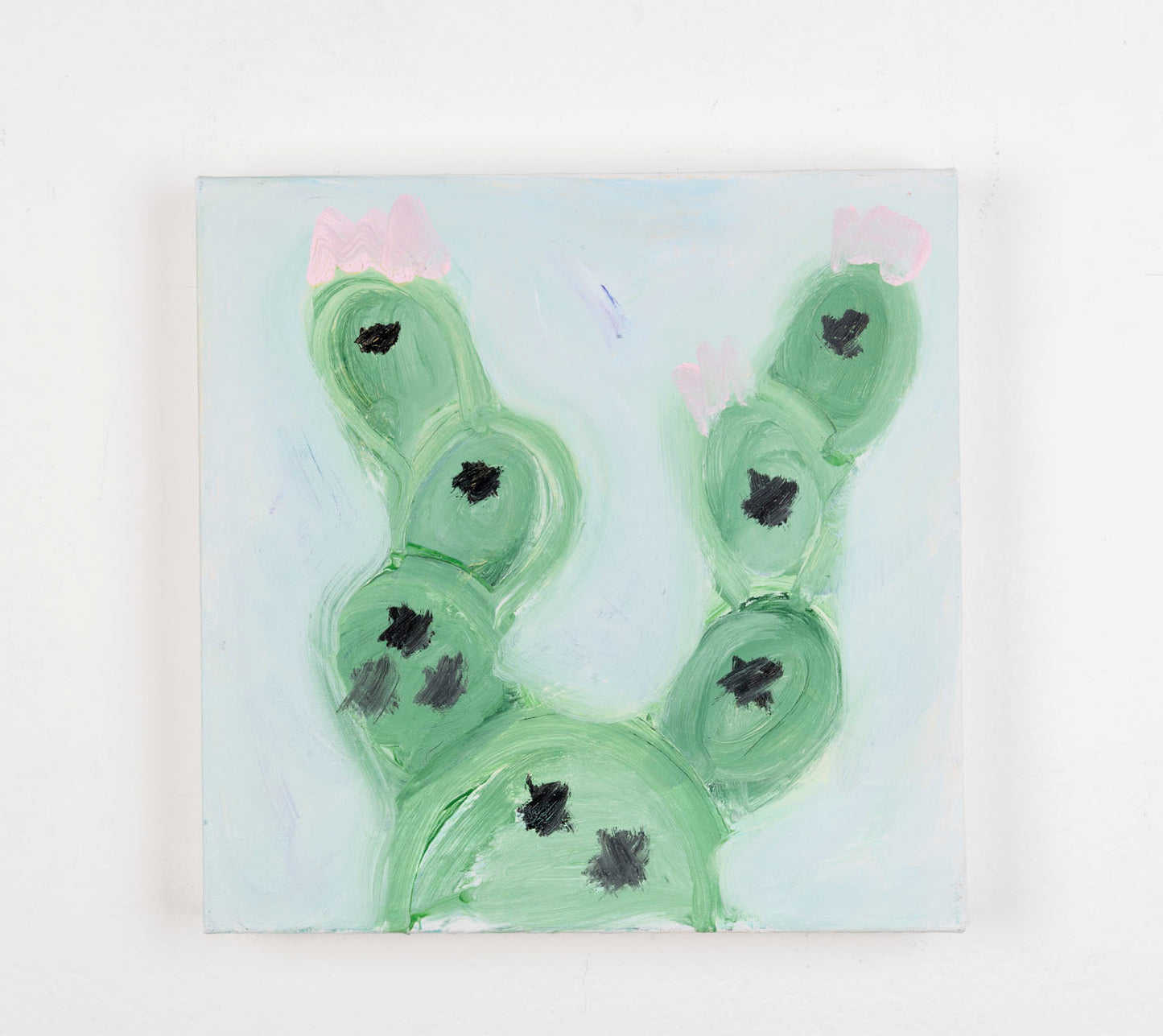 This is a painting of a cactus plant. The cactus is a muted green color, with the spiky details in black and a light pink, all against a light blue background.
