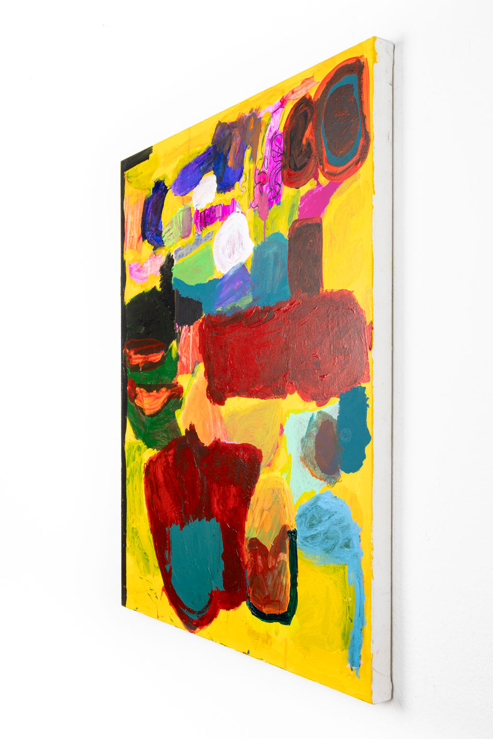 This is an abstract painting with multi-colored marks; red, green black and blue against a bright yellow background. The left border is outlined with black ink. 