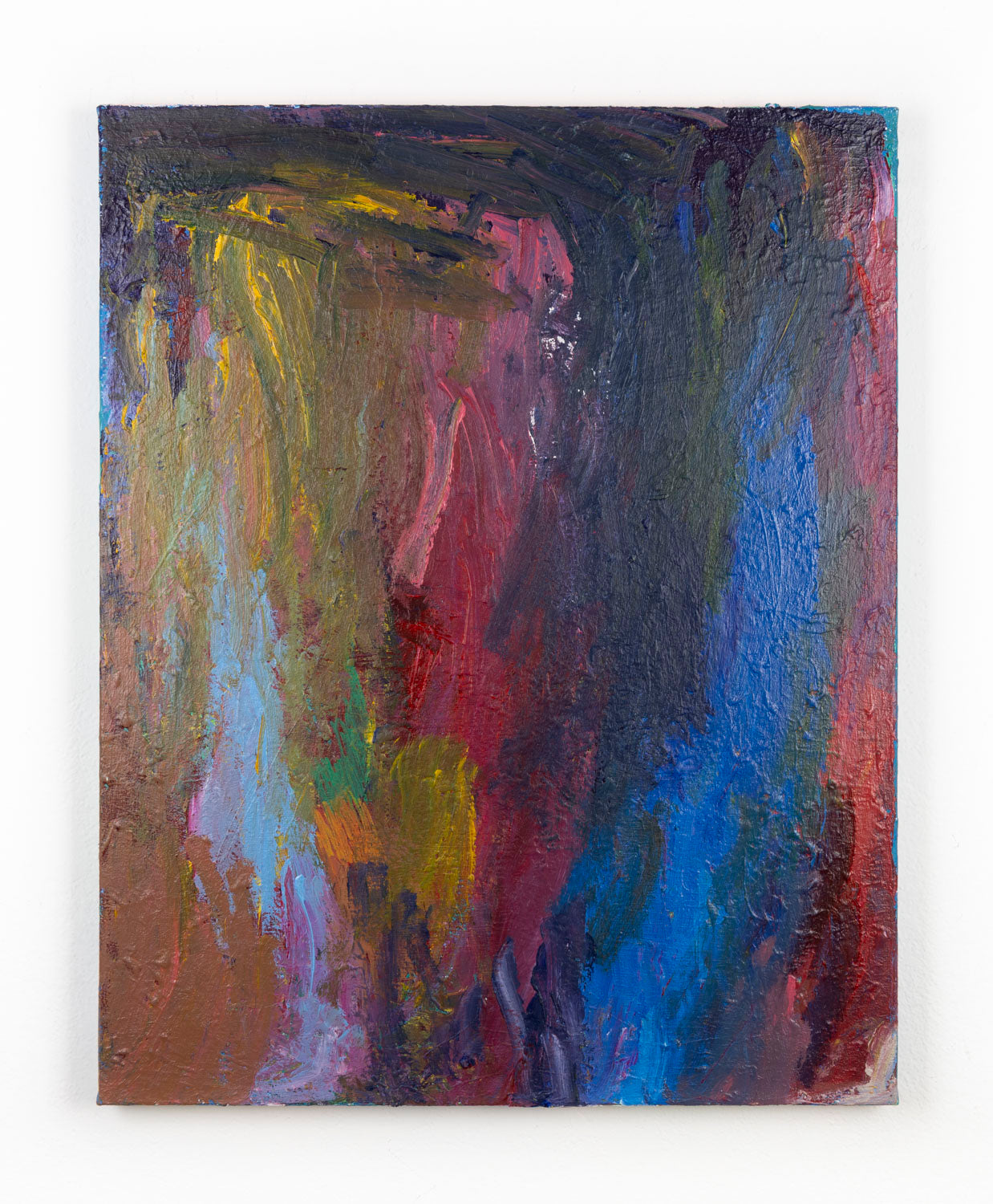 This abstract painting contains gestural mark-making, with a multi-colored palette of varying shades of blue, red, yellow and orange. The artist's hand is highlighted through bold bush strokes.