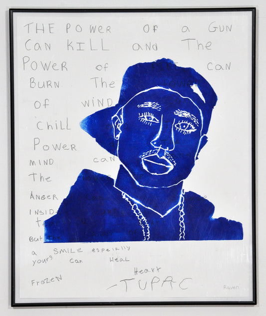 A framed work on white paper. In the center there is a linocut print in bright blue ink, detailing the head and shoulders of a figure wearing a cap, sweatshirt, and chain necklace. The portrait represents the musician Tupac. Text from a poem by Tupac is handwritten around and across the portrait, filling the white surface of the paper. The poem reads, in part: "the power of anger can rage inside until it tears u apart but the power of a smile especially yours can heal a frozen heart."