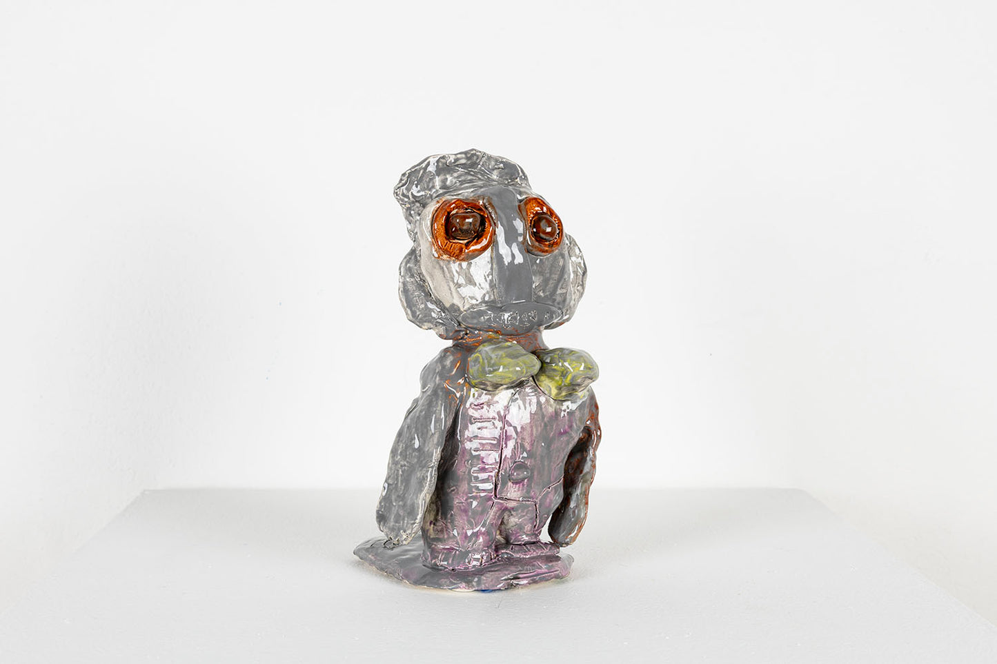 The same figurative sculpture photographed from the side. 