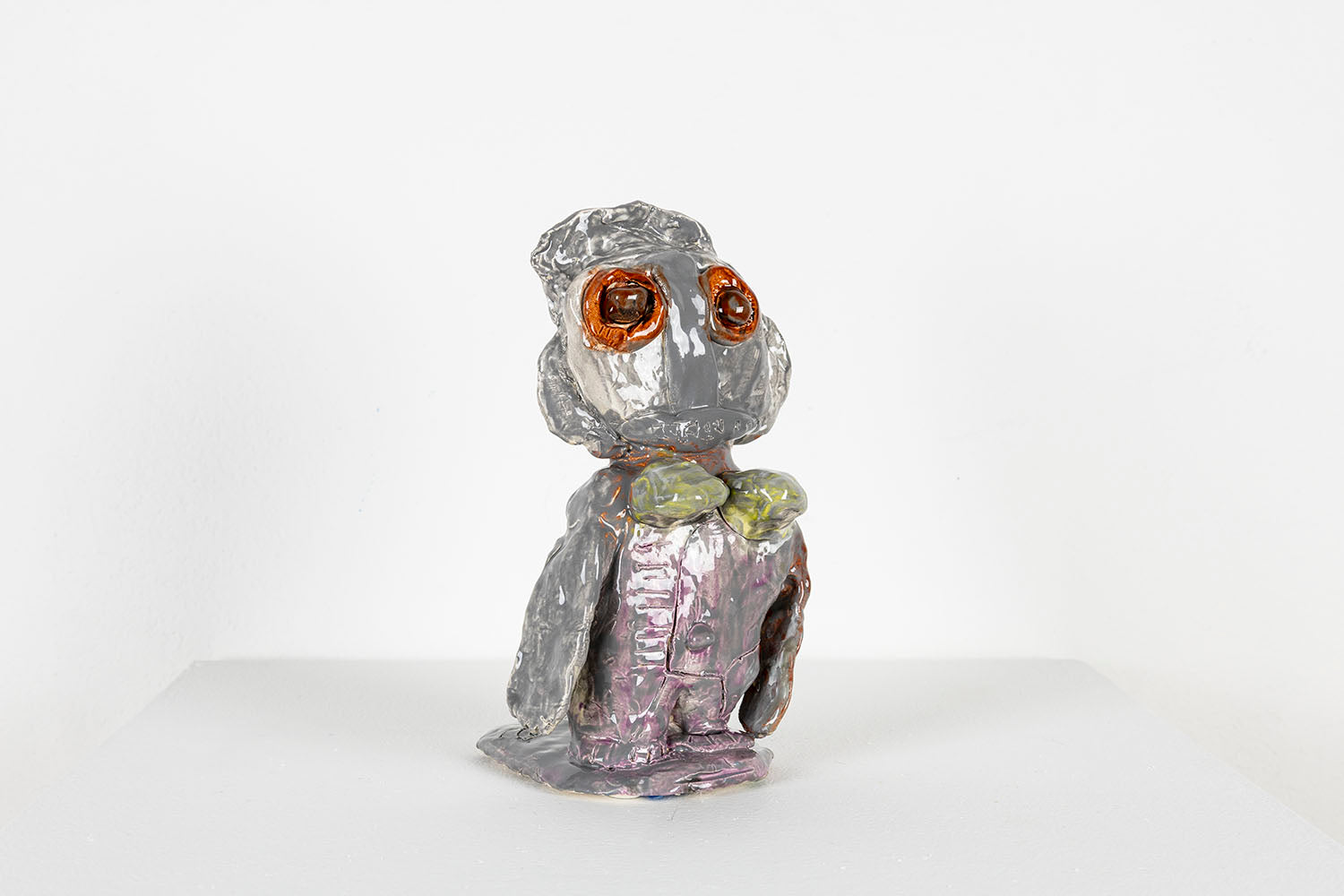 The same figurative sculpture photographed from the side. 