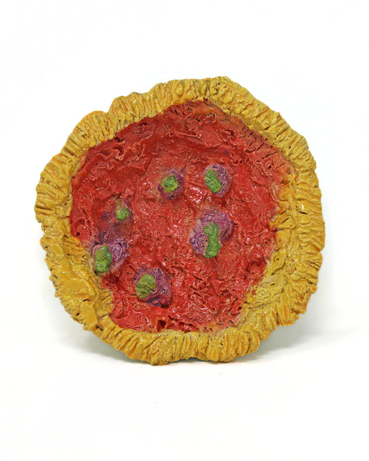 This ceramic sculpture is bowl shaped, with the outside of the bowl a bright lime green glaze and the inside a vibrant red. The lip of the bowl is glazed with a bright yellow. The piece consists of organic carvings that create a jagged texture. In the center of the bowl, there are 6 elements glazed with the same lime green that protrude from the surface.