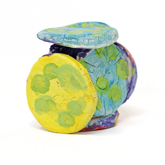 The ceramic sculpture contains 6 circles that are all connected. The piece is glazed with vibrant colors, including varying shades of green, red, blue, purple and yellow. There are also carved details on the face of each circle.