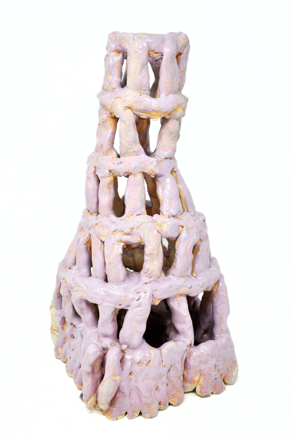 A ceramic sculpture of a tower. It's coated with matte and glossy lilac glaze. The tower is six tiers tall, wider at the base. It's made of little cylinders: some are stacked vertically and others are wrapped around the tower in horizontal bands. There are gaps between each cylinder through which the white background or dark interior are visible.