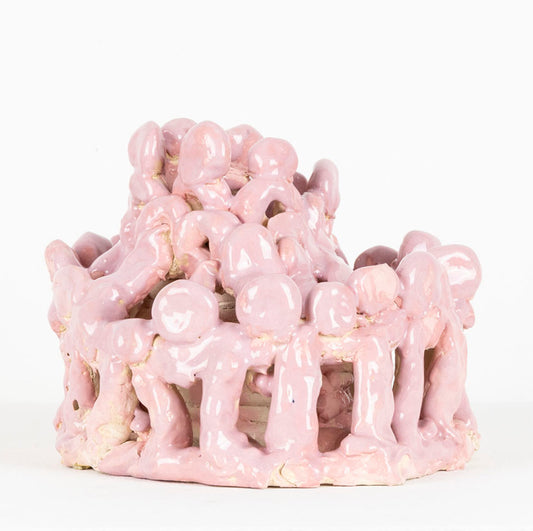 Pink ceramic sculpture against a white background