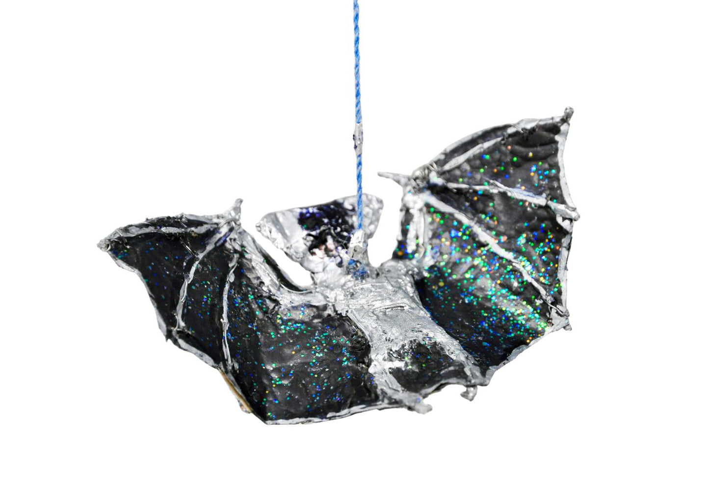 The same ornament sculpture photographed from the back. Here the backside of the bat's body and wings are more clearly in focus. The full description of the item is detailed in the previous image.