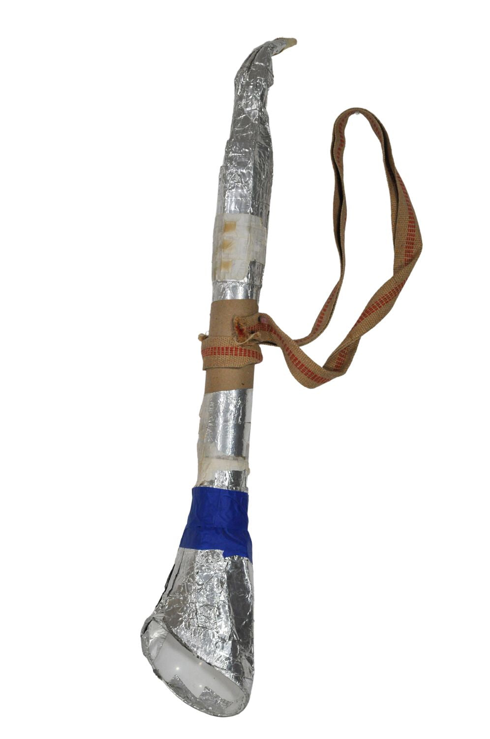 A long, narrow silver wind instrument features a mouthpiece and a the width expands outwards slightly towards the bottom. There is a band of blue towards the bell of the instrument, and it has a woven tan and red strap attached to it, about midway down, like one to be worn around a musician's neck. 