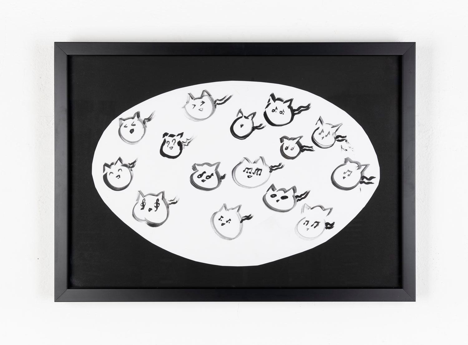 This black ink drawing consists of 15 cat heads in the center of the piece. The cats are contained in a white oval which contrasts the black background.
