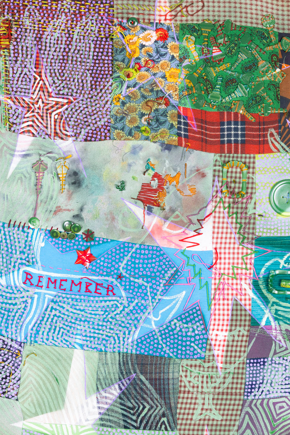 A detail of a colorful patchwork on stretcher bars with acrylic line-work depicting a human figure from the waist up. Two hands stretch upwards. Ten five- and six-pointed stars are layered in a negative image over the figure and patchwork. The word "remember" is embroidered in red. Found keys, halloween vampire teeth, and a large button are also sewn onto the patchwork. 