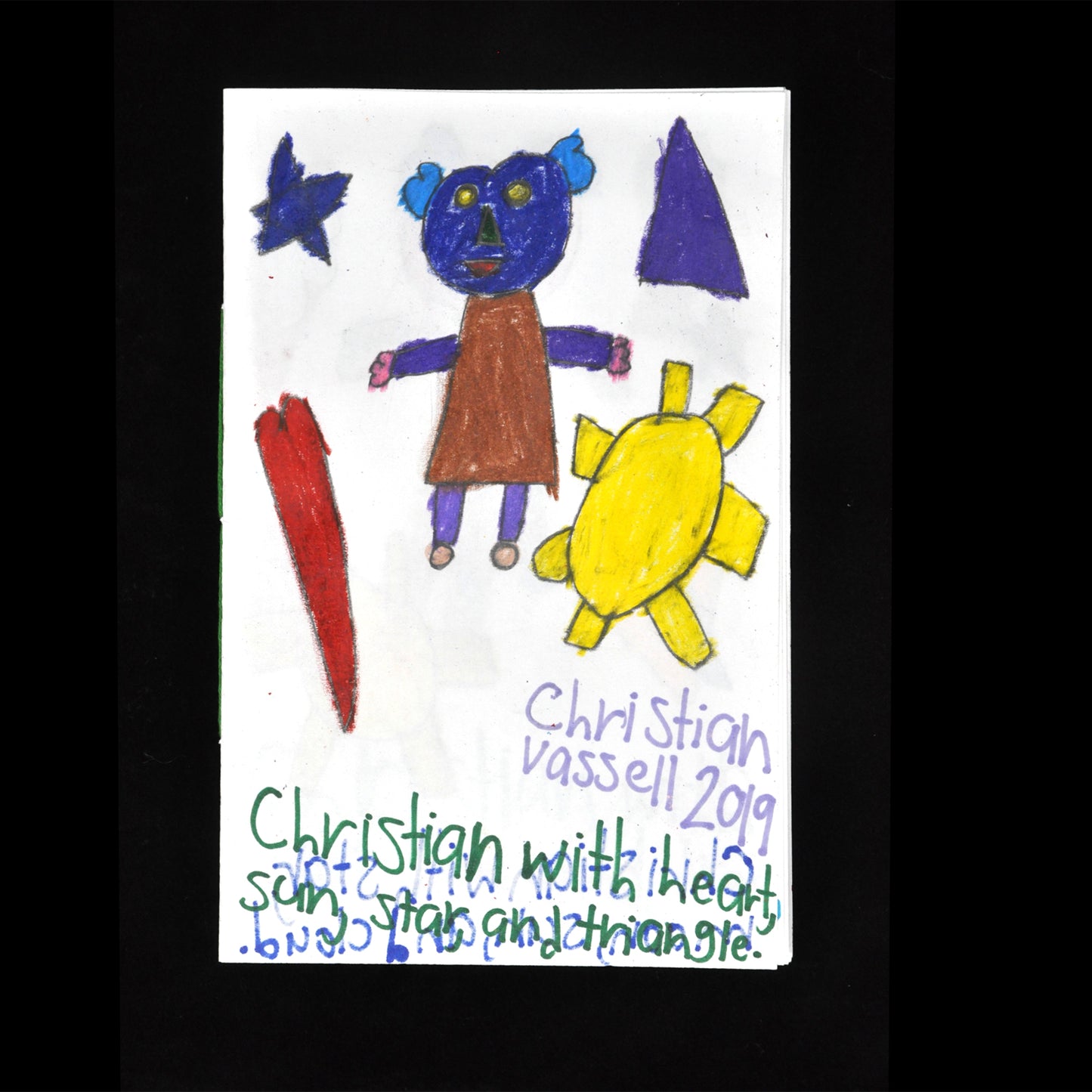 Drawing featuring a figure at the center with a blue face and brown dress. Surrounding the figure are a red heart, a blue star, a purple triangle, and a yellow sun. Text below includes the artist's name 2019 in purple marker and green marker that says "Christian with heart, sun, star, and triangle."