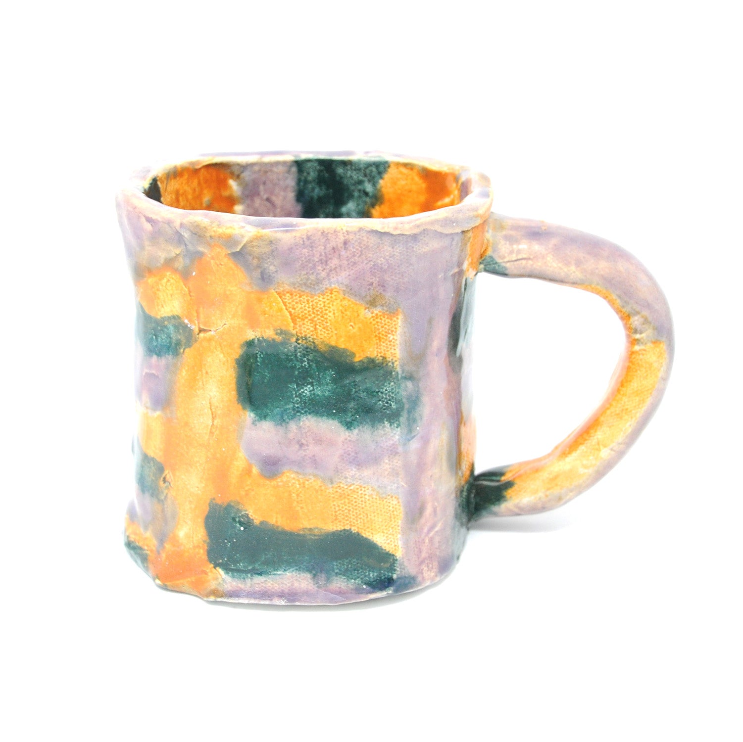 a hand built ceramic mug with a thin curved handle. The mug is glazed with purple, green, and yellow stripes that interlock in a woven pattern.