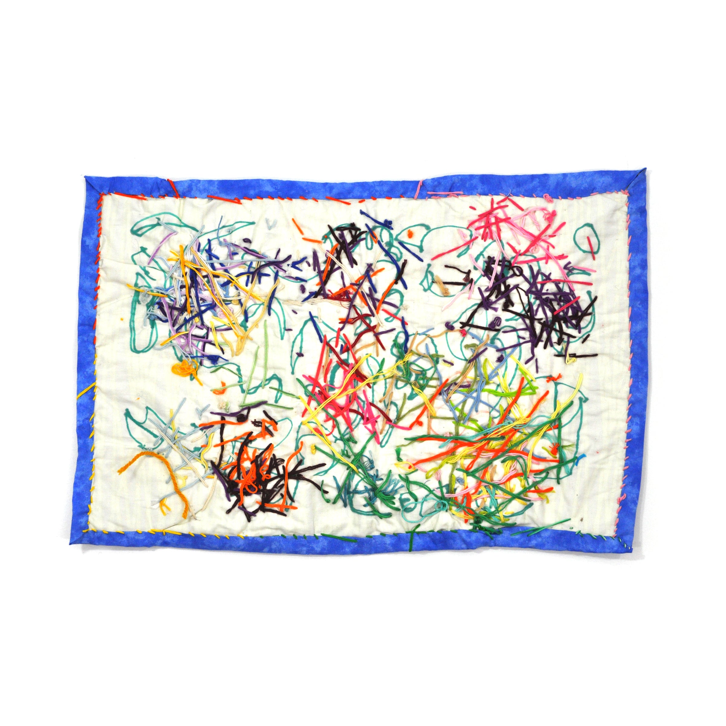 A rectangular fiber work made of a white cloth with a blue border.  The artist has drawn on the fabric with green marker and then embroidered clusters of colorful thread across the entire surface. The blue border is stitched on with a pink and yellow blanket stitch. 