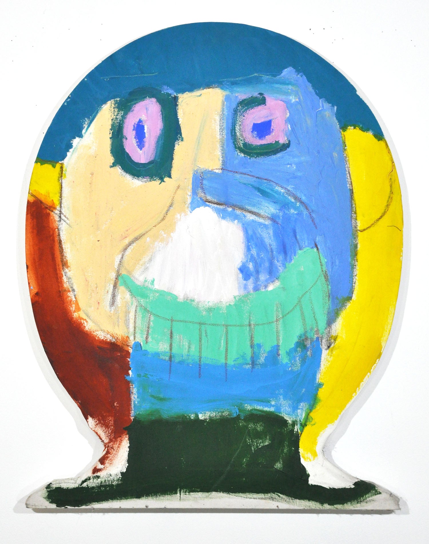 An abstract face is painted on a canvas that is shaped like a head. The eyes are  pink and blue, and the colors of the face are roughly split in half, pale yellow on the left and sky blue on the right. There are various other colors around the perimeter, medium blue, bright yellow, burnt orange, mint green, and dark green. 