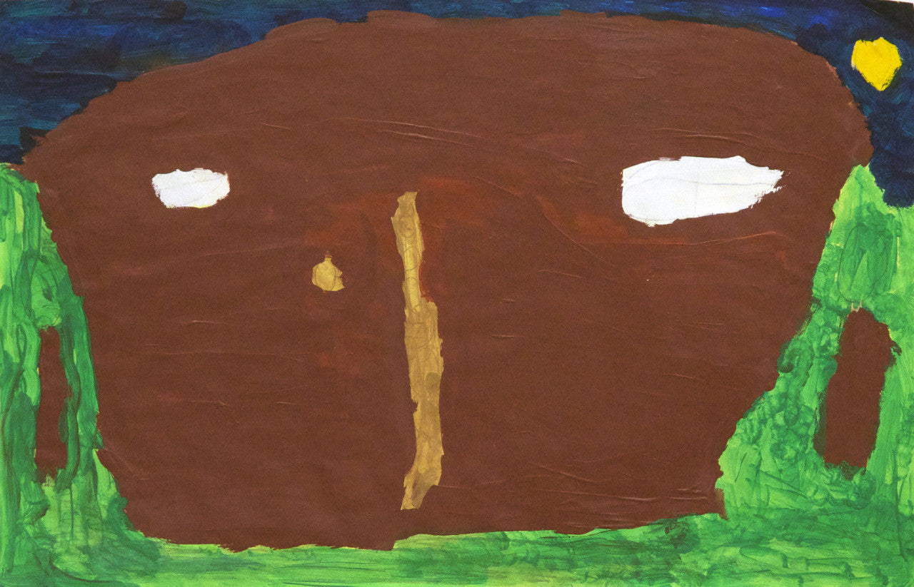 a painting on paper. The image features a dark blue sky with a yellow moon, a green field, and in the center a large brown shape representing a house. The house has two white windows that resemble eyes, a thin tan sliver possibly indicating a doorframe, and a little gold door knob. There is a tree on either side of the house. 