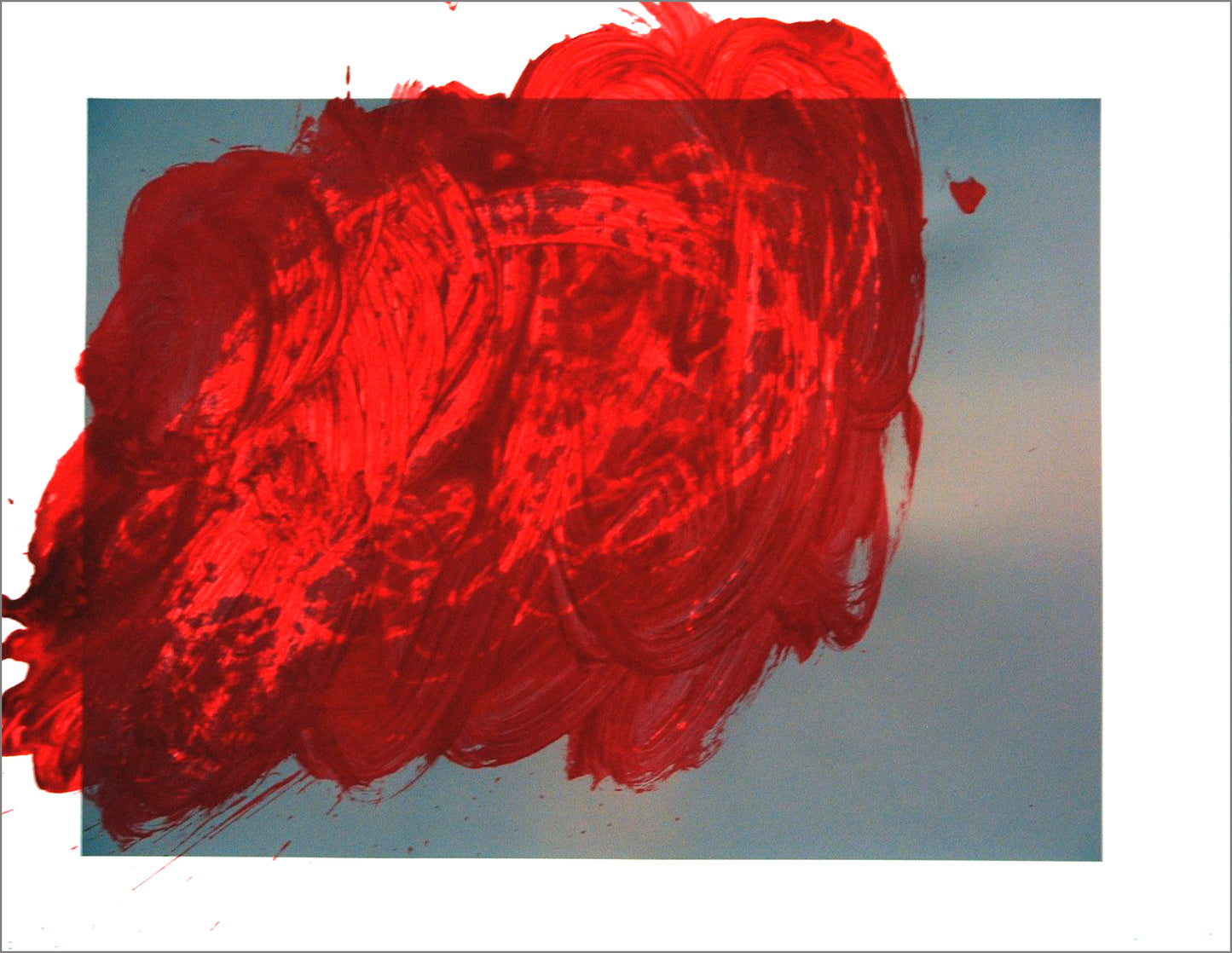 A painting on paper. The paper has an ink jet print of a hazy blue and pink sky. Over this image, the artist has added a big swirl of bright red paint, like a cloud dramatically illuminated by the setting sun. 