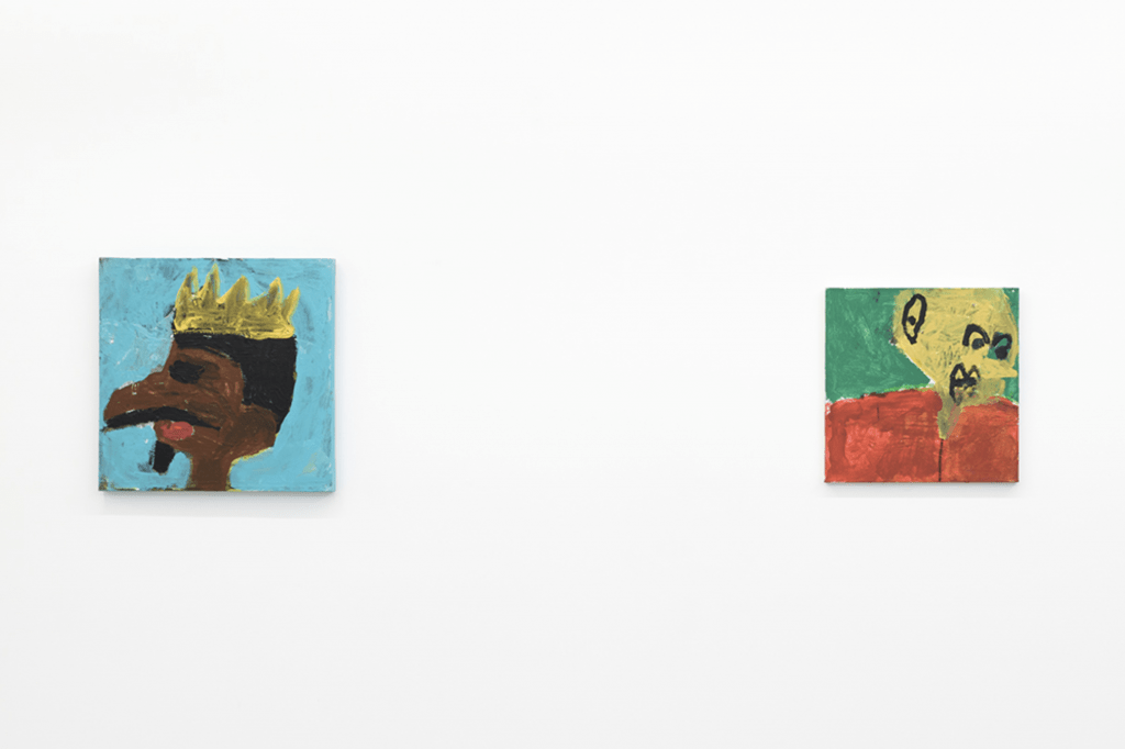Installation photo of two untitled portrait paintings by NIAD studio artist Billy White