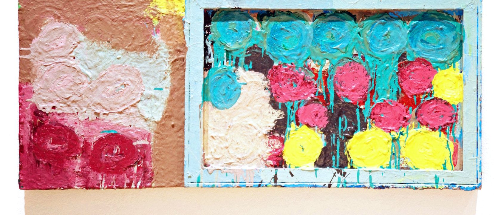 an acrylic painting on two joined canvases. a square on the left features thickly layered paint in reds, pinks, creamy white and a dash of yellow in the upper right corner. A rectangle with a light blue wooden frame attached features a similar pattern of round shapes, thickly painted, but in bright and drippy blues, pinks, and yellows, with a patch of the same creamy white in the lower left corner.