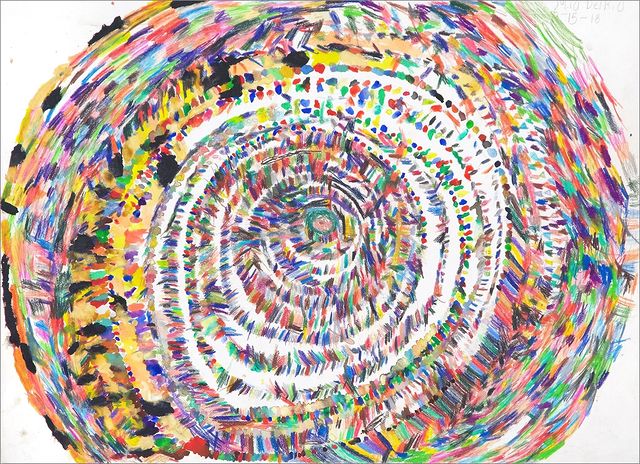 a rainbow hued artwork of multiple concentric circles